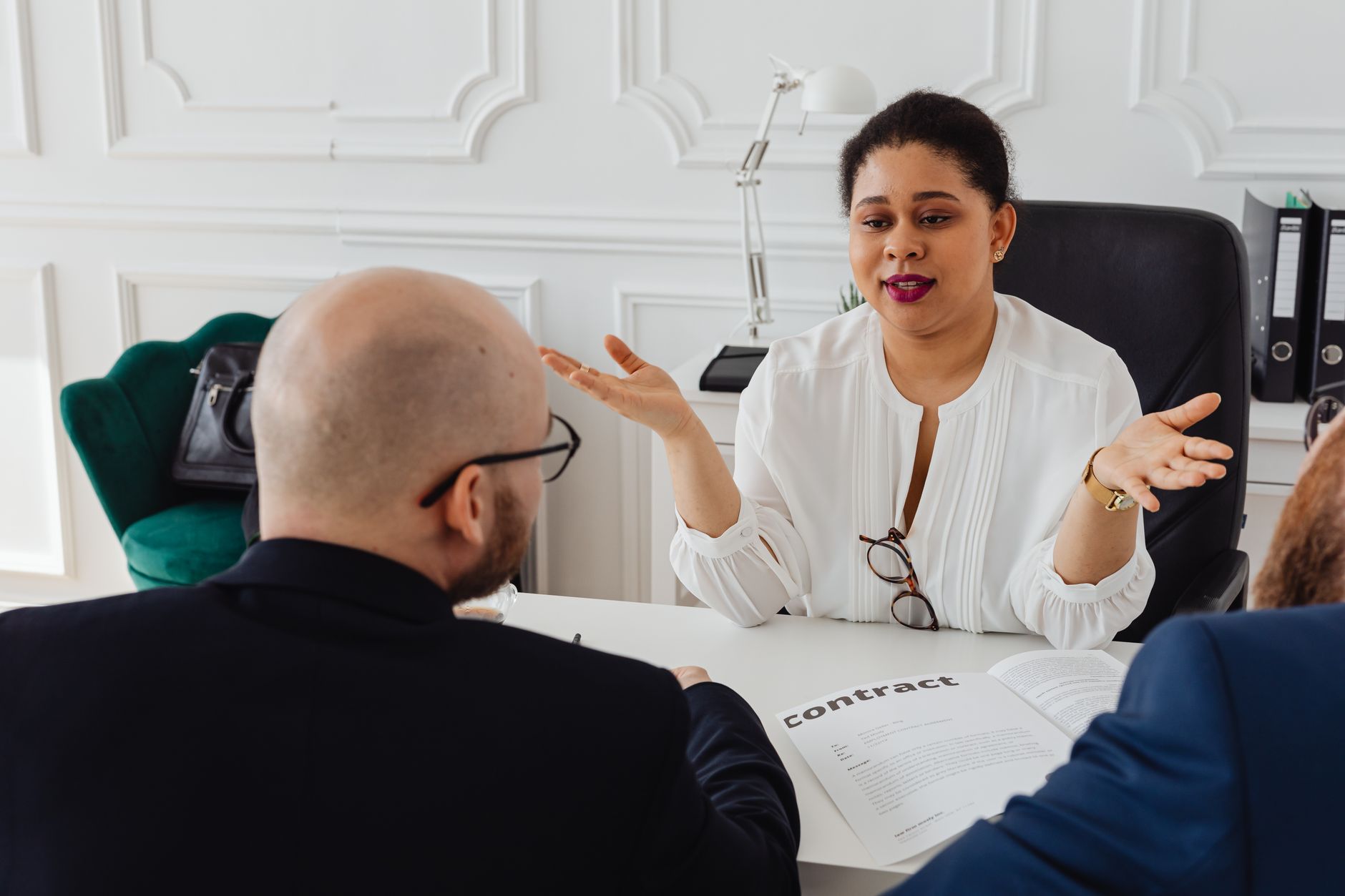 Person explaining documents during a meeting